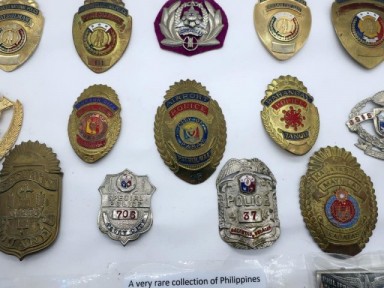 Panel fifteen Philippines Police badges - Lugosi Auctioneers & Valuers