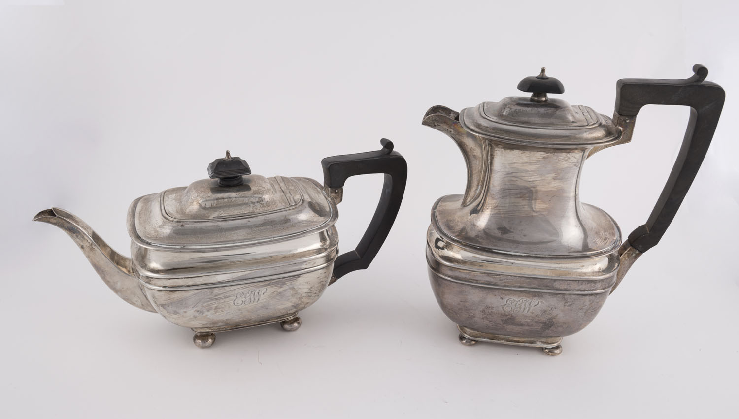 An English sterling silver teapot and coffee pot retailed by William